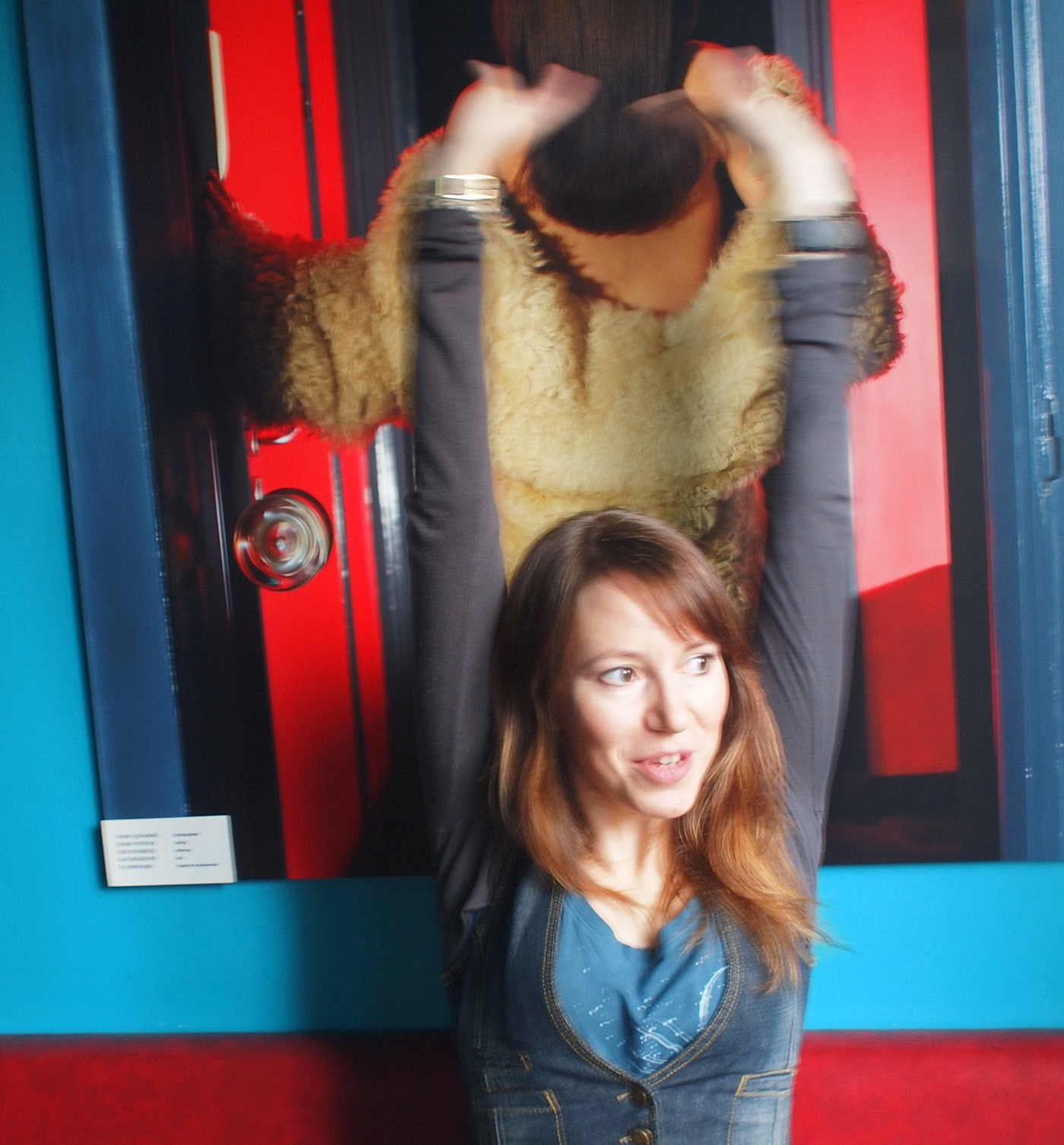 Sadness Theory the artist stretching her arms up